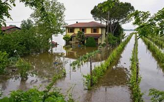 A general view shows a flooded property on May 20, 2023 in the village of Ghibullo, near Ravenna, after floodwaters hit the Emilia-Romagna region. The toll from floods that have devastated Italy's Emilia Romagna region rose to 14 on May 19, amid calls for the government to revive an abandoned project to mitigate the impact of natural disasters. (Photo by Andreas SOLARO / AFP) (Photo by ANDREAS SOLARO/AFP via Getty Images)