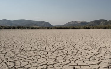 ZARCILLA DE RAMOS, SPAIN - JULY 28:  Dried cracked mud is seen at the Valdeinfierno reservoir on July 28, 2017 in Zarcilla de Ramos, Spain. Valdeinfierno is one of the Spain's oldest reservoir which was used to feed the fields of Lorca and Totana and nowadays is absolutelly unusable due to cracks on the dam and mud level on its bed. As the severe drought in Spain's Southeastern regions of Albacete, Guadalajara, Murcia and Almeria continues for a second straight year, water levels of the region's main reservoir are worryingly low. Despite of the national water levels are currently near 50% of its total capacity, the main reservoir feeding these regions are below 13% of their capacity. This prolonged drought and how the government is managing the water sharing among these regions are deeply hitting their economy. According to the Spain's environment ministry figures, Southern Spain's deserts are spreading and a third of the country is at risk of suffering a process of desertification as climate change, droughts, tourism add to farming pressure on the southeastern regions of Spain.  (Photo by David Ramos/Getty Images)