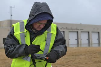 An environmental engineer with EA Engineering, Science, and Technology, Inc. works to identify more than 220 surface soil sampling sites during a remedial investigation into the presence of Per- and Polyfluoroalkyl substances at Truax Field in Madison, Wisconsin, March 22, 2022. The investigation marks the second major step in the Environmental Protection Agency’s Comprehensive Environmental Response, Compensation, and Liability Act process which will guide the mitigation of PFAS compounds on and around the Air National Guard installation.