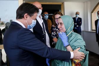 italian cooperator, Silvia Romano, wearing a green tunic, is welcomed by the italian prime minister Giuseppe Conte upon her arrival at the Ciampino airport, Rome, Italy, 10 May 2020. Silvia Romano was kidnapped on Novembre 2018 in Kenya. ANSA/FABIO FRUSTACI