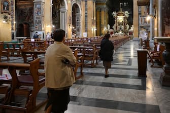 People arrive to attend a mass at the church of Santa Maria in Traspontina in Rome on May 18, 2020 during the country's lockdown aimed at curbing the spread of the COVID-19 infection, caused by the novel coronavirus. - Restaurants and churches reopen in Italy on May 18, 2020 as part of a fresh wave of lockdown easing in Europe and the country's latest step in a cautious, gradual return to normality, allowing businesses and churches to reopen after a two-month lockdown. (Photo by Vincenzo PINTO / AFP) (Photo by VINCENZO PINTO/AFP via Getty Images)