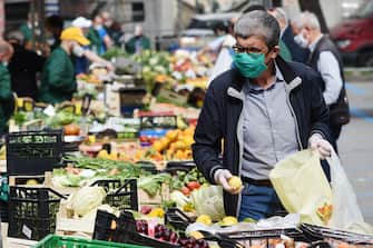 SALERNO, ITALY - MAY 18: A local market reopens on May 18, 2020 in Salerno, Italy. Restaurants, bars, cafes, hairdressers and other shops have reopened, subject to social distancing measures, after more than two months of a nationwide lockdown meant to curb the spread of Covid-19. (Photo by Francesco Pecoraro/Getty Images)