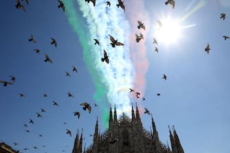 Pigeons fly in front of the Italian flag drawn by the steam left by the Italian Air Forces aerobatic demonstration team, the Frecce Tricolori, as they fly over the cathedral in Milan, Italy, 25 May 2020. From today the Frecce Tricolori will draw it every day in the Italian sky, flying over all the regions. It will be a big hug to the Italians which will close in Rome on June 2nd for the Republic Day.
ANSA/MATTEO BAZZI