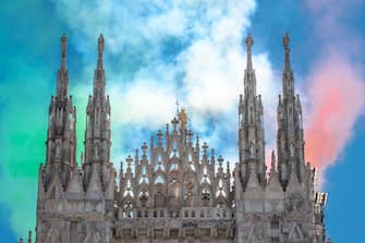 MILAN, ITALY - MAY 25:  Italyâ  s aerobatic team Frecce Tricolori (Tricolour arrows) fly over Milan in Duomo Square as part of celebrations for the 74th anniversary of the proclamation of the Italian Republic on May 25, 2020 in Milan, Italy.  The national acrobatic patrol will carry out a series of flyovers during a week-long air parade across all of Italyâ  s regions as a symbolic embrace of the nation with the tricolour fumes and as a sign of unity, solidarity and recovery.  (Photo by Francesco Prandoni/Getty Images)
