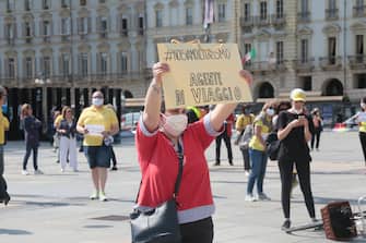 Protesta adesso in piazza castello a Torino davanti alla sede della regione Piemonte dei operatori e agenzie viaggi Protesta adesso in piazza castello a Torino davanti alla sede della regione Piemonte dei operatori e agenzie viaggi (Costa1/Fotogramma, TORINO - 2020-05-27) p.s. la foto e' utilizzabile nel rispetto del contesto in cui e' stata scattata, e senza intento diffamatorio del decoro delle persone rappresentate
