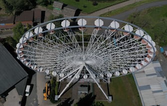 An aerial view shows a ferris wheel at the closed amusement parc Fort Fun Abenteuerland in Bestwig, western Germany, on May 6, 2020, amid the spread of the novel coronavirus COVID-19. - The Fort Fun Abenteuerland is a seasonal amusement park near Bestwig-Wasserfall in the Sauerland with about 40 attractions and two shows. (Photo by Ina FASSBENDER / AFP) (Photo by INA FASSBENDER/AFP via Getty Images)