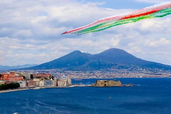 The aerobatic demonstration team 'Frecce Tricolori ' of the Italian Air Force, leaving green, white, and red smoke trails, flies in formation above the Gulf of Naples, southern Italy, 28 May 2020. Starting from 25 May 2020, the Frecce Tricolori are performing every day in the skies throughout Italy as part of the 74th anniversary celebrations of the founding of the Italian Republic and to pay homage to the areas most affected by the coronavirus disease (COVID-19) pandemic. The initiative will end on 02 June in Rome on the occasion of the Republic Day (Italian National Day). 
ANSA/ CIRO FUSCO