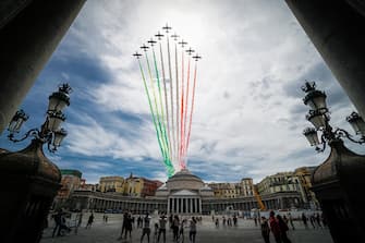 The aerobatic demonstration team 'Frecce Tricolori ' of the Italian Air Force, leaving green, white, and red smoke trails, flies in formation above Plebiscito square in Naples, southern Italy, 28 May 2020. Starting from 25 May 2020, the Frecce Tricolori are performing every day in the skies throughout Italy as part of the 74th anniversary celebrations of the founding of the Italian Republic and to pay homage to the areas most affected by the coronavirus disease (COVID-19) pandemic. The initiative will end on 02 June in Rome on the occasion of the Republic Day (Italian National Day). ANSA/ CESARE ABBATE