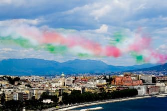 The aerobatic demonstration team 'Frecce Tricolori ' of the Italian Air Force, leaving green, white, and red smoke trails, flies in formation above the Gulf of Naples, southern Italy, 28 May 2020. Starting from 25 May 2020, the Frecce Tricolori are performing every day in the skies throughout Italy as part of the 74th anniversary celebrations of the founding of the Italian Republic and to pay homage to the areas most affected by the coronavirus disease (COVID-19) pandemic. The initiative will end on 02 June in Rome on the occasion of the Republic Day (Italian National Day).
ANSA/ CIRO FUSCO