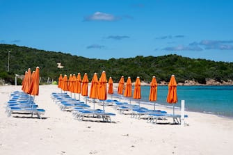 PORTO CERVO, ITALY - MAY 30: Detail of closed umbrellas at an empty beach in Sardinia due to the restriction on Covid-19 on May 30, 2020 in Porto Cervo, Italy. Sardinia is still closed to tourists as imposed by Governor Solinas. Many Italian businesses have been allowed to reopen, after more than two months of a nationwide lockdown meant to curb the spread of Covid-19. (Photo by Emanuele Perrone/Getty Images)