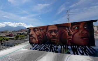 A huge mural created by Italian street artist Jorit Agoch in memory of George Floyd is seen in Naples, southern Italy, 04 June 2020. Faces of Lenin, Martin Luther King, Malcolm X and Angela Davis are also painted on the mural. 
ANSA/ CIRO FUSCO