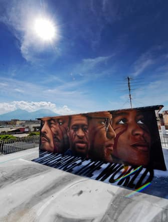 A huge mural created by Italian street artist Jorit Agoch in memory of George Floyd is seen in Naples, southern Italy, 04 June 2020. Faces of Lenin, Martin Luther King, Malcolm X and Angela Davis are also painted on the mural. 
ANSA/ CIRO FUSCO