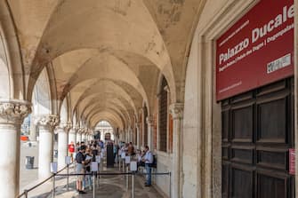 VENICE, ITALY - JUNE 13: Tourists are waiting to enter the Doge's Palace, which reopened today on June 13, 2020 in Venice, Italy. The whole country is returning to normality after more than two months of a nationwide lockdown meant to curb the spread of Covid-19. (Photo by Stefano Mazzola/Awakening/Getty Images)