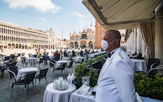 VENICE, ITALY - JUNE 12: Customers enjoy the reopening of the Florian Cafè after 3 months of closure due to Covid-19 on June 12, 2020 in Venice, Italy. The whole country is returning to normality after more than two months of a nationwide lockdown meant to curb the spread of Covid-19. (Photo by Simone Padovani/Awakening/Getty Images)