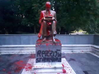The statue dedicated to Indro Montanelli has been smeared with red paint, located in the homonymous garden in via Palestro, in the center of Milan, Italy, 13 June 2020. "Racist, rapist" the writing that was made in black on the basis of the statue that represents the journalist.
ANSA/STRINGER
