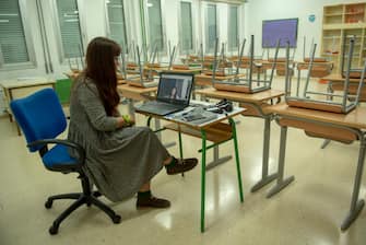 IRUN, SPAIN - MAY 25: A teacher teaches online classes in an empty classroom at Eguzkitza Secondary School on May 25, 2020 in Irun, Spain. Some parts of Spain have entered the so-called "Phase One" or "Phase Two" transitions from its coronavirus lockdown, allowing many shops to reopen as well as restaurants who serve customers outdoors. Locations that were harder hit by coronavirus (Covid-19), such as Madrid and Barcelona, remain in a stricter quarantine. (Photo by Gari Garaialde/Getty Images)