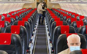MILAN, ITALY - JUNE 03:  A man sitting alone inside an empty airplane due to restrictions from COVID-19 on June 03, 2020 in Milan, Italy. Flights have started again from the ease of the Covid-19 lockdown on June 3rd.  (Photo by Lorenzo Palizzolo/Getty Images)