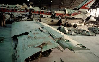 ROME, ITALY - OCTOBER 30: In a hangar of the military airport of Pratica di Mare (Rome) the reassembled of Itavia plane flight 870 which crashed on June 27th, 1980 is seen during a judicial inquiry on October 30, 1992 in Rome, Italy. On June 27th, 1980 the Itavia flight 870 which crashed between the islands of Ponza and Ustica killing all 81 people on board. This event led to many investigations, accusations and misdirections, and continues to be a source of controversy in the country. (Photo by Franco Origlia/Getty Images)