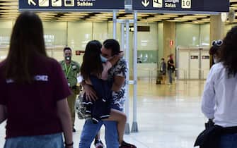 MADRID, SPAIN - JUNE 21: People hug each other at the Adolfo Suarez Madrid Barajas airport on June 21, 2020 in Madrid, Spain. From today Spanish citizens can move around the country after almost one hundred days of alarm state because of the coronavirus crisis. (Photo by Ely Pineiro/Getty Images)