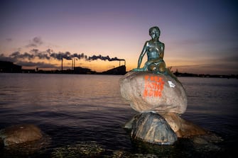 The lettering "Free Hong Kong" is written on the base of the Little Mermaid statue in Copenhagen after it has been exposed to vandalism early Monday, January 13, 2020. (Photo by Thomas Sjoerup / Ritzau Scanpix / AFP) / Denmark OUT (Photo by THOMAS SJOERUP/Ritzau Scanpix/AFP via Getty Images)