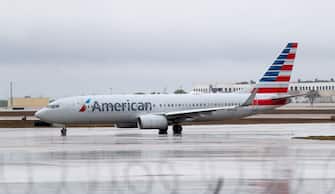 1212233533 DALLAS, TEXAS - MARCH 13: A view of an American Airlines jet at Dallas/Fort Worth International Airport (DFW) on March 13, 2020 in Dallas, Texas. American Airlines announced that it is cutting a third of its international flights amid a major slowdown due to the Coronavirus (COVID-19) outbreak. (Photo by Tom Pennington/Getty Images)