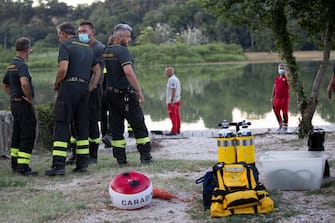 A helicopter crashed into the Tiber outside Rome, Italy, 10 July 2020. Eye witnesses said it snagged overhead power lines and then crashed, sinking to the bottom of the river. Divers are looking for survivors.
ANSA/MASSIMO PERCOSSI