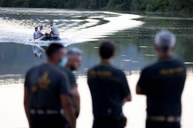 A helicopter crashed into the Tiber outside Rome, Italy, 10 July 2020. Eye witnesses said it snagged overhead power lines and then crashed, sinking to the bottom of the river. Divers are looking for survivors.
ANSA/MASSIMO PERCOSSI