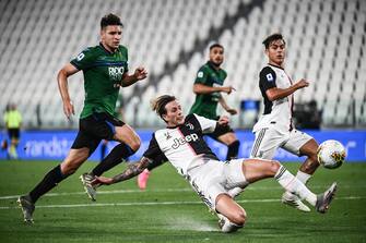Juventus' Italian forward Federico Bernardeschi (R) defends against Atalanta's Albanian defender Berat Djimsiti during the Italian Serie A football match Juventus Turin vs Atalanta Bergamo played behind closed doors on July 11, 2020 at the Juventus stadium in Turin, as the country eases its lockdown aimed at curbing the spread of the COVID-19 infection, caused by the novel coronavirus. (Photo by Marco BERTORELLO / AFP) (Photo by MARCO BERTORELLO/AFP via Getty Images)