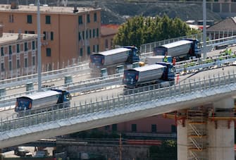 Static testing of the new Genoa bridge has started, in Genoa, Italy, 19 July 2020. Eight trucks are currently moving on the new viaduct on the Polcevera river. The trucks entered the bridge on the east side, on the southbound carriageway, and then turned back, to continue with some maneuvers on the new structure. The new bridge is under construction after the Morandi highway bridge partially collapsed on 14 August 2018, killing a total of 43 people. ANSA/LUCA ZENNARO