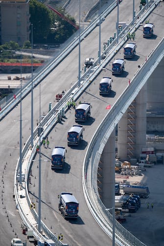Static testing of the new Genoa bridge has started, in Genoa, Italy, 19 July 2020. Eight trucks are currently moving on the new viaduct on the Polcevera river. The trucks entered the bridge on the east side, on the southbound carriageway, and then turned back, to continue with some maneuvers on the new structure. The new bridge is under construction after the Morandi highway bridge partially collapsed on 14 August 2018, killing a total of 43 people. ANSA/LUCA ZENNARO