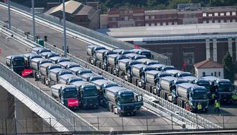 Trucks drive over the new Genoa bridge as static testing of the bridge has started, in Genoa, Italy, 19 July 2020. Eight trucks are moving on the new viaduct on the Polcevera river. The trucks entered the bridge on the east side, on the southbound carriageway, and then turned back, to continue with some maneuvers on the new structure. The new bridge is under construction after the Morandi highway bridge partially collapsed on 14 August 2018, killing a total of 43 people. 
ANSA/LUCA ZENNARO

