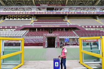 The deserted stands at theOlimpico Grande Torino stadium due to the containment measures of the Coronavirus, ahead of the staret of the italian Serie A soccer match Torino FC vs Parma Calcio, Turin, Italy, 20 June 2020.  After more than three months of stop due to the emergency Coronavirus starts the Serie A. The first scheduled match is between Turin and Parma. The two teams will play at 19.30, in an Olympic stadium Grande Torinothe recovery of the 25th matchday of Serie A. ANSA/ ALESSANDRO DI MARCO