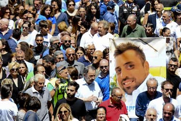 The picture of Carabinieri's officer Mario Cerciello Rega is shown during his funeral in his hometown of Somma Vesuviana (Naples), southern Italy, 29 July 2019. Two American teenagers were jailed in Rome on Saturday as authorities investigate their alleged roles in the fatal stabbing of the Italian police officer on a street near their hotel.
ANSA / CIRO FUSCO