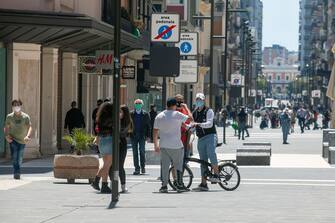 BARI, ITALY - MAY 09: People on the street, stroll in via Sparano, in the center of city on May 09, 2020 in Bari, Italy. Italy was the first country to impose a nationwide lockdown to stem the transmission of the Coronavirus (Covid-19), and its restaurants, theaters and many other businesses remain closed. (Photo by Donato Fasano/Getty Images)