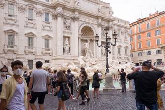 ROME, ITALY - JUNE 07: Romans walking around admire the Trevi Fountain on June 07, 2020 in Rome, Italy. Many Italian businesses have been allowed to reopen, after more than two months of a nationwide lockdown meant to curb the spread of Covid-19. (Photo by Fabrizio Villa/Getty Images)