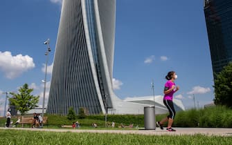 MILAN, ITALY - MAY 10:  A runner intent on his daily trainingin CityLife Park during the first sunday of phase two of the containment of the pandemic from Covid-19  on May 10, 2020 in Milan, Italy. Italy was the first country to impose a nationwide lockdown to stem the transmission of the Coronavirus (Covid-19), and its restaurants, theaters and many other businesses remain closed. (Photo by Roberto Finizio/Getty Images)