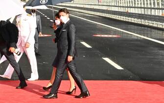 Italy's Prime minister Giuseppe Conte and Italy's transport minister Paola De Micheli (L) arrive to attend the inauguration ceremony of the new San Giorgio bridge on August 3, 2020 in Genoa. - The new high-tech structure will have four maintenance robots running along its length to spot weathering or erosion, as well as a special dehumidification system to limit corrosion. Italy inaugurates a sleek new bridge in Genoa, though relatives of the 43 people killed when the old viaduct collapsed say the pomp and ceremony risk overshadowing the tragedy. (Photo by Andreas SOLARO / AFP) (Photo by ANDREAS SOLARO/AFP via Getty Images)