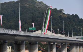 A picture taken on August 3, 2020 in Genoa shows the new San Giorgio bridge on its inauguration day. - The new high-tech structure will have four maintenance robots running along its length to spot weathering or erosion, as well as a special dehumidification system to limit corrosion. Italy inaugurates a sleek new bridge in Genoa, though relatives of the 43 people killed when the old viaduct collapsed say the pomp and ceremony risk overshadowing the tragedy. (Photo by Luca ZENNARO / POOL / AFP) (Photo by LUCA ZENNARO/POOL/AFP via Getty Images)
