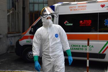 Health workers in full protective gear suits spray disinfectant as a precaution against the spread of the coronavirus Covid-19, in S.Martino hospital. Genova, Italy, 23 April 2020. Countries around the world are taking measures to stem the widespread of the SARS-CoV-2 coronavirus which causes the Covid-19 disease. ANSA/LUCA ZENNARO