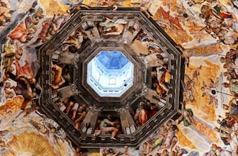 A picture taken on February 23, 2017 shows the fresco "Last Judgment" (Giudizio Universale) by Italian artist Giorgio Vasari in the dome built by Italian architect Filippo Brunelleschi, also known as the Brunelleschi's dome, part of the Santa Maria del Fiore cathedral (Saint Mary of the Flowers), in Florence.
The Opera of Santa Maria del Fiore launched "Autography on the Brunelleschi's dome", an initiative that allows visitors to leave virtual signs thank to tablets placed in the cathedral, instead of writing their messages on the monument's walls. The messages will be stored on the "Autography" website and archived online. / AFP / VINCENZO PINTO / RESTRICTED TO EDITORIAL USE - MANDATORY MENTION OF THE ARTIST UPON PUBLICATION - TO ILLUSTRATE THE EVENT AS SPECIFIED IN THE CAPTION        (Photo credit should read VINCENZO PINTO/AFP via Getty Images)