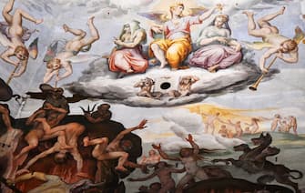 A picture taken on February 23, 2017 shows the fresco "Last Judgment" (Giudizio Universale) by Italian artist Giorgio Vasari in the dome built by Italian architect Filippo Brunelleschi, also known as the Brunelleschi's dome, part of the Santa Maria del Fiore cathedral (Saint Mary of the Flowers), in Florence.
The Opera of Santa Maria del Fiore launched "Autography on the Brunelleschi's dome", an initiative that allows visitors to leave virtual signs thank to tablets placed in the cathedral, instead of writing their messages on the monument's walls. The messages will be stored on the "Autography" website and archived online. / AFP / VINCENZO PINTO / RESTRICTED TO EDITORIAL USE - MANDATORY MENTION OF THE ARTIST UPON PUBLICATION - TO ILLUSTRATE THE EVENT AS SPECIFIED IN THE CAPTION        (Photo credit should read VINCENZO PINTO/AFP via Getty Images)