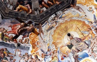 A picture taken on February 23, 2017 shows the fresco "Last Judgment" (Giudizio Universale) by Italian artist Giorgio Vasari in the dome built by Italian architect Filippo Brunelleschi, also known as the Brunelleschi's dome, part of the Santa Maria del Fiore cathedral (Saint Mary of the Flowers), in Florence.
The Opera of Santa Maria del Fiore launched "Autography on the Brunelleschi's dome", an initiative that allows visitors to leave virtual signs thank to tablets placed in the cathedral, instead of writing their messages on the monument's walls. The messages will be stored on the "Autography" website and archived online. / AFP / VINCENZO PINTO / RESTRICTED TO EDITORIAL USE - MANDATORY MENTION OF THE ARTIST UPON PUBLICATION - TO ILLUSTRATE THE EVENT AS SPECIFIED IN THE CAPTION        (Photo credit should read VINCENZO PINTO/AFP via Getty Images)