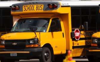 SEATTLE, WA - MAY 06: School buses sit idle in a bus yard on May 6, 2020 in Seattle, Washington. Since the outbreak of COVID-19 and the closure of all school buildings, the Seattle Public Schools Nutrition Services Department has been distributing breakfast and lunch to students through a network of 26 school sites and 43 bus routes five days a week. The meal distribution also includes additional food for weekends. Approximately 6,500 people are served per day through the program. (Photo by Karen Ducey/Getty Images)