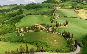 Landscape of Valdorcia with a farm with cypress trees lines, central Tuscany, along ancient and historical Francigena's way, where the famous colors of the spring come out. Valdorcia lands has recognized since 2004 by Unesco as world humanity patrimony, gathering thousands of tourists every years on four seasons from all over the world, during the lockdown phase 2 emergency period aimed to conserve low spread level of Covid-19 coronavirus and open more free circulation of people, Monticchiello, Italy, 07 May 2020.
ANSA/ FABIO MUZZI