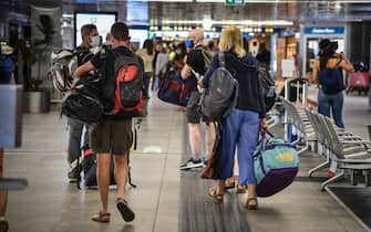 Passengers on the Iberia flight from Madrid arrive at Linate airport in Milan, Italy, August 17, 2020. Lombardy Region government is working to set up nearby at the Linate and Malpensa airports, by the middle of the next week, swab stations also involving facilities hospital.Ansa / Matteo Corner