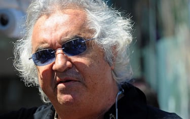 epa08625302 (FILE) - Former Renault Formula One Team manager Flavio Briatore seen before the 2011 Formula One Grand Prix of Monaco at the Monte Carlo circuit, in Monaco, 29 May 2011 (reissued 25 August 2020). According to media reports, Italian businessman Flavio Briatore was hospitalized with coronavirus in Milan, Italy. Some 63 people have tested positive for COVID-19 at Sardinian nightclub 'Billlionaire' which is owned by Briatore.  EPA/VINCENT DAMOURETTE