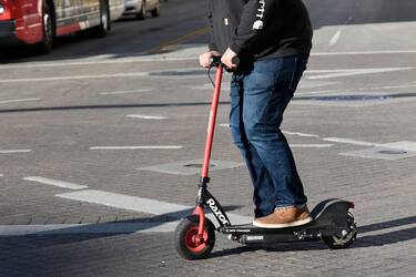 SAN ANTONIO, TEXAS - DECEMBER 9, 2018:  A tourist rides a rented battery-powered electric scooter in downtown San Antonio, Texas. (Photo by Robert Alexander/Getty Images)