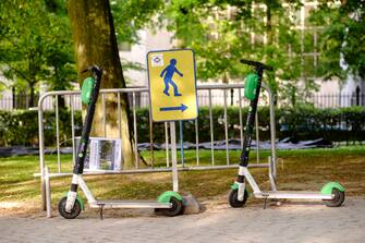 BRUSSELS, BELGIUM - MAY 21:  Two electric kick scooter in the Parc Leopld of Brussels. (Photo by Thierry Monasse/Getty Images)