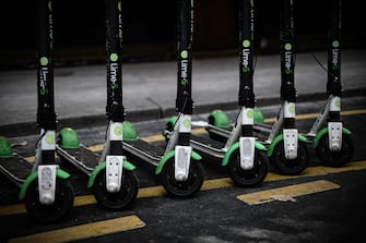 This picture taken on June 12, 2019 shows Lime-S electric scooters of US transportation company Lime parked in a street of Paris. (Photo by Philippe LOPEZ / AFP)        (Photo credit should read PHILIPPE LOPEZ/AFP via Getty Images)