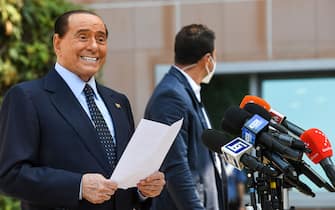 Former Italian prime minister Silvio Berlusconi addresses the media, as he leaves the San Raffaele Hospital in Milan on September 14, 2020 after he tested posititive for coronavirus and was hospitalied since September 3. (Photo by Piero CRUCIATTI / AFP) (Photo by PIERO CRUCIATTI/AFP via Getty Images)